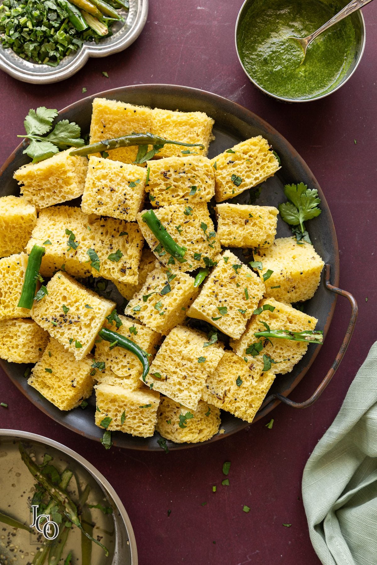 Gujarati steamed savoury cake pieces arranged in a platter.