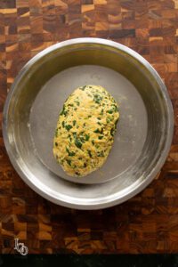Kneaded Methi paratha dough in a wide plate.