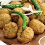Gujarat na Daal Vada | Spicy lentils deep fried Fritters served on a newspaper
