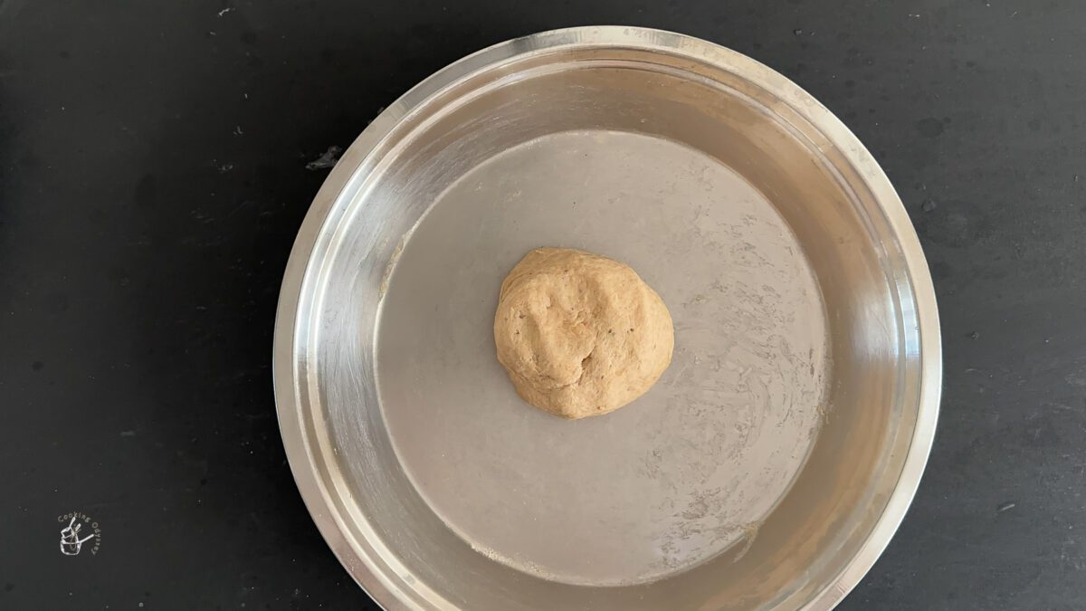 dough for ajwain parathas in a big stainless steel plate.