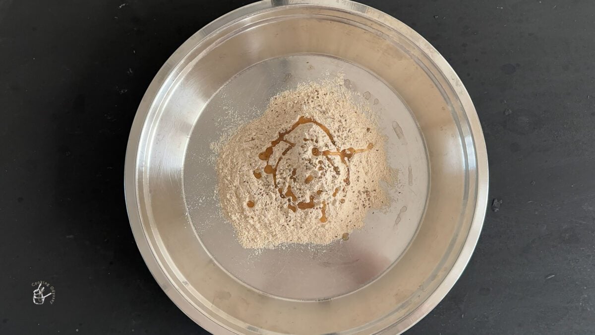In a plate flour, carom seeds and salt mixed to make paratha.