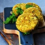 tofu cutlets served on a black wooden board