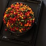 Palak Beet Masala Boondi - Spicy Spinach , Beetroot Gram Flour pearls placed in a bowl