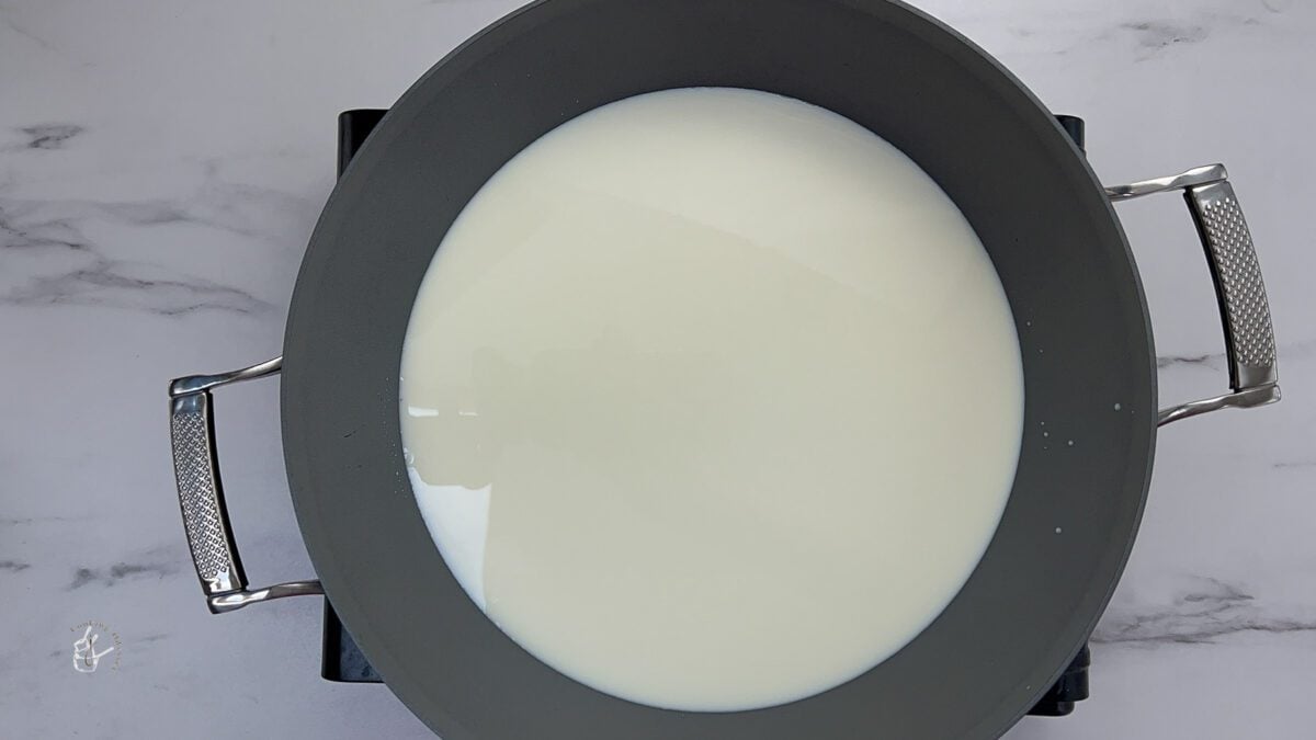 milk in the pan to make Gujarati doodh pak recipe