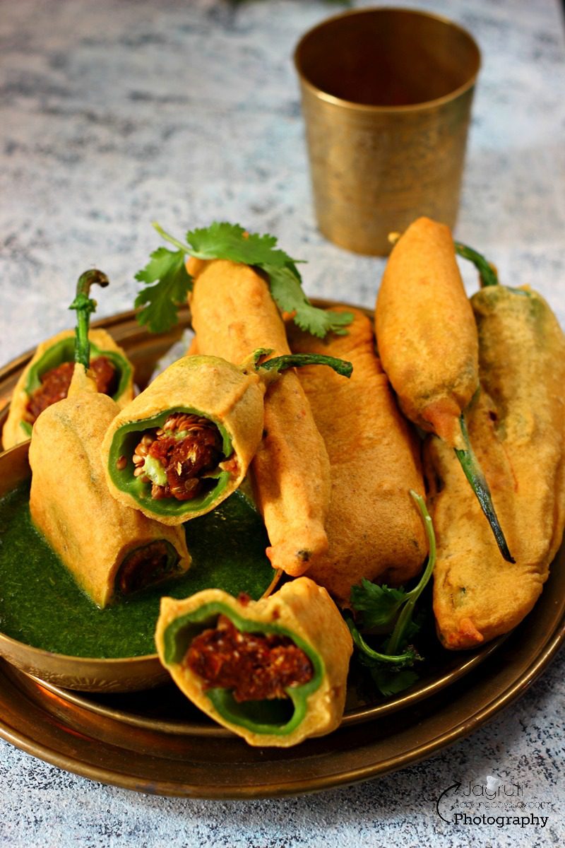 Date Cashew Chilli Bhajji - Bhajiya placed on a brass plate