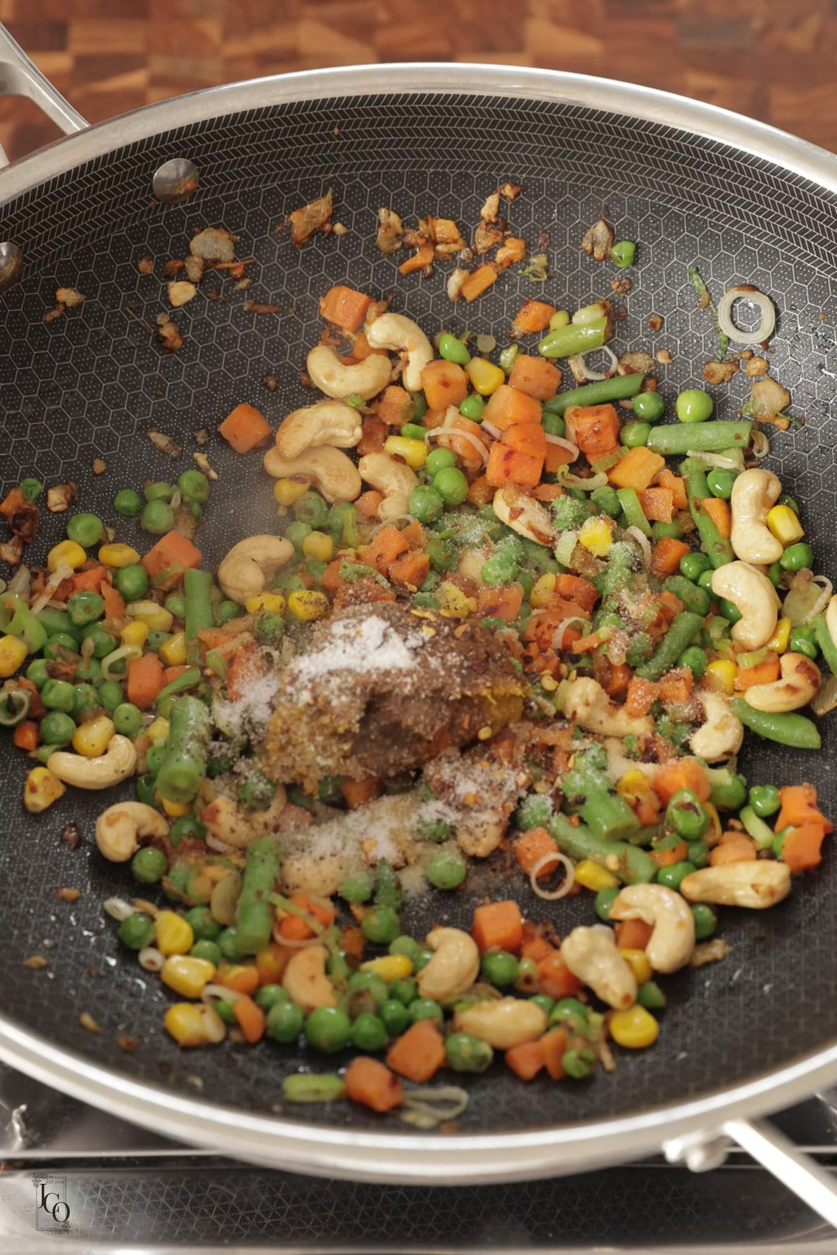 Thai curry paste, soy sauce, and salt added to cooked mixed veggies.