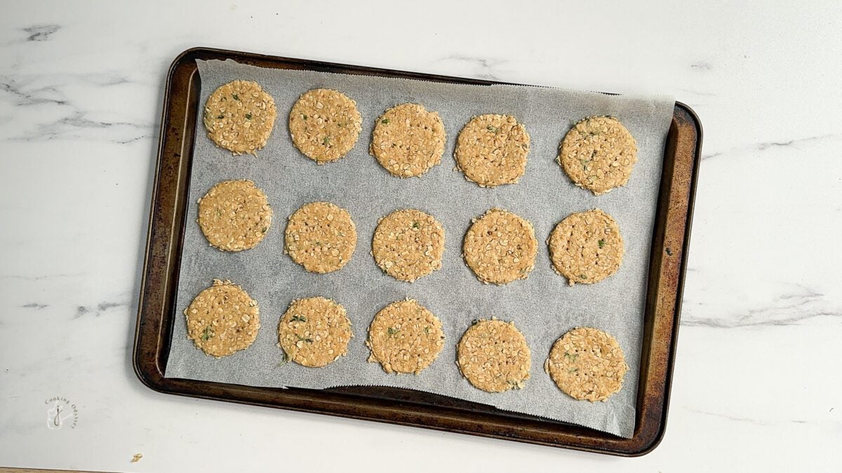 raw oatcakes on a baking tray