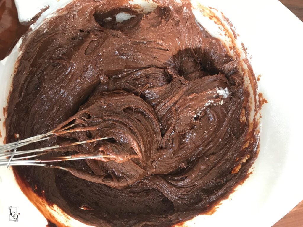 Raw batter of coca cola brownies in a bowl.