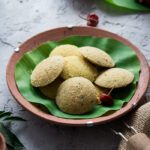 Quick vegan oats idlis served on a banana leaf with coconut chutney