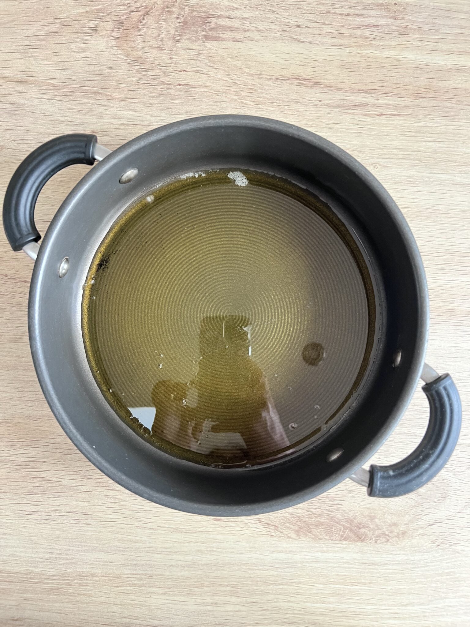 step by step sooji no siro recipe - melted ghee in a pan