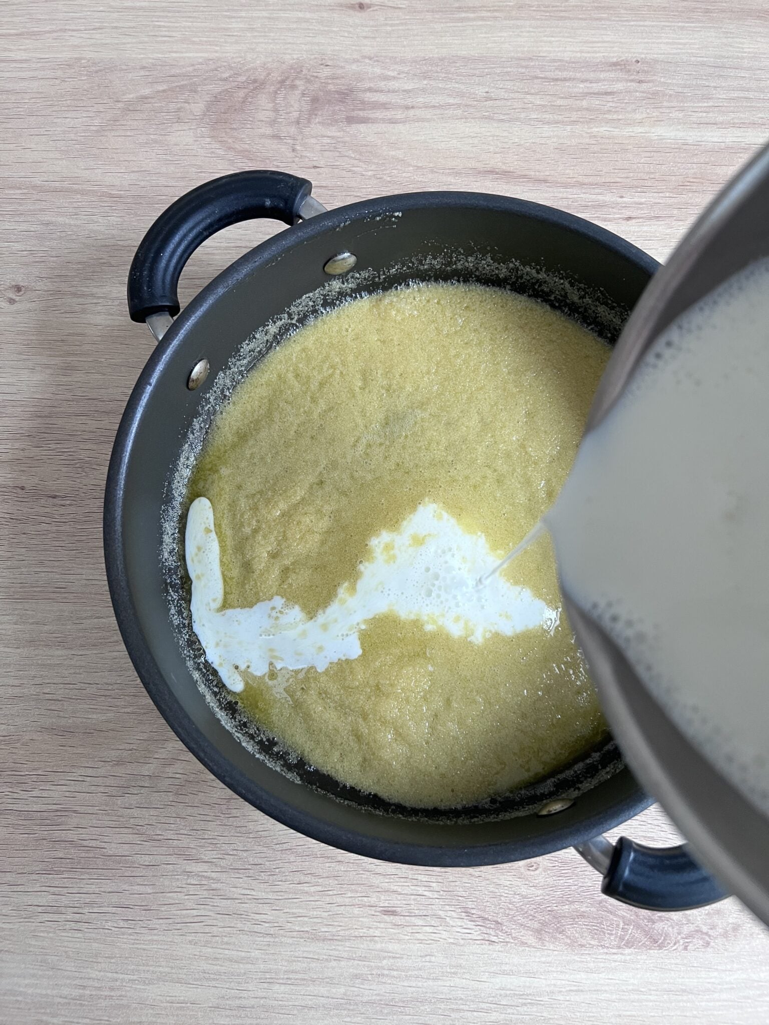 hot milk going in to the roasted semolina