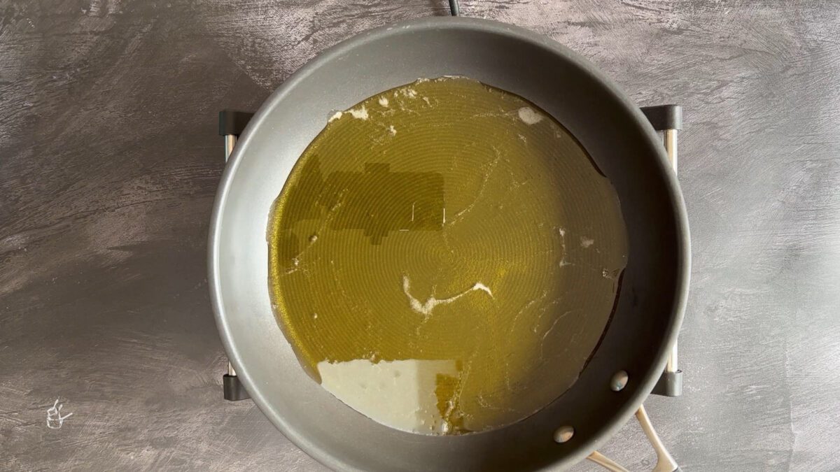 Melted ghee in the frying pan to make aate ka halwa