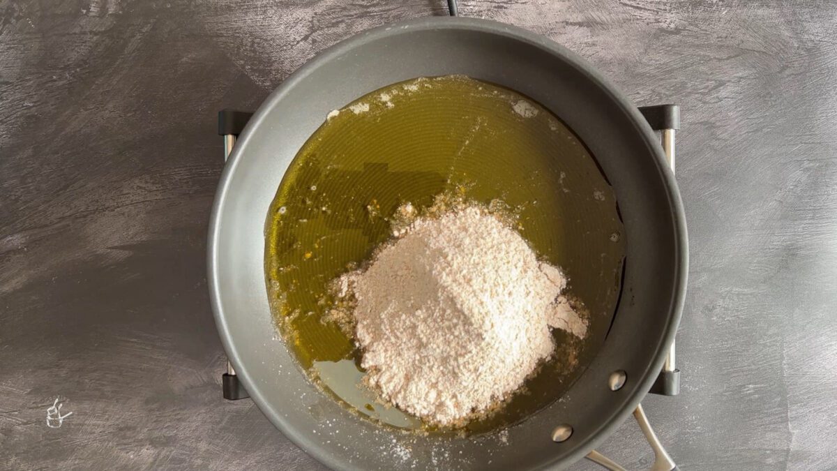 gehu ka aata added to the melted ghee to make gehu ke aate ka halwa
