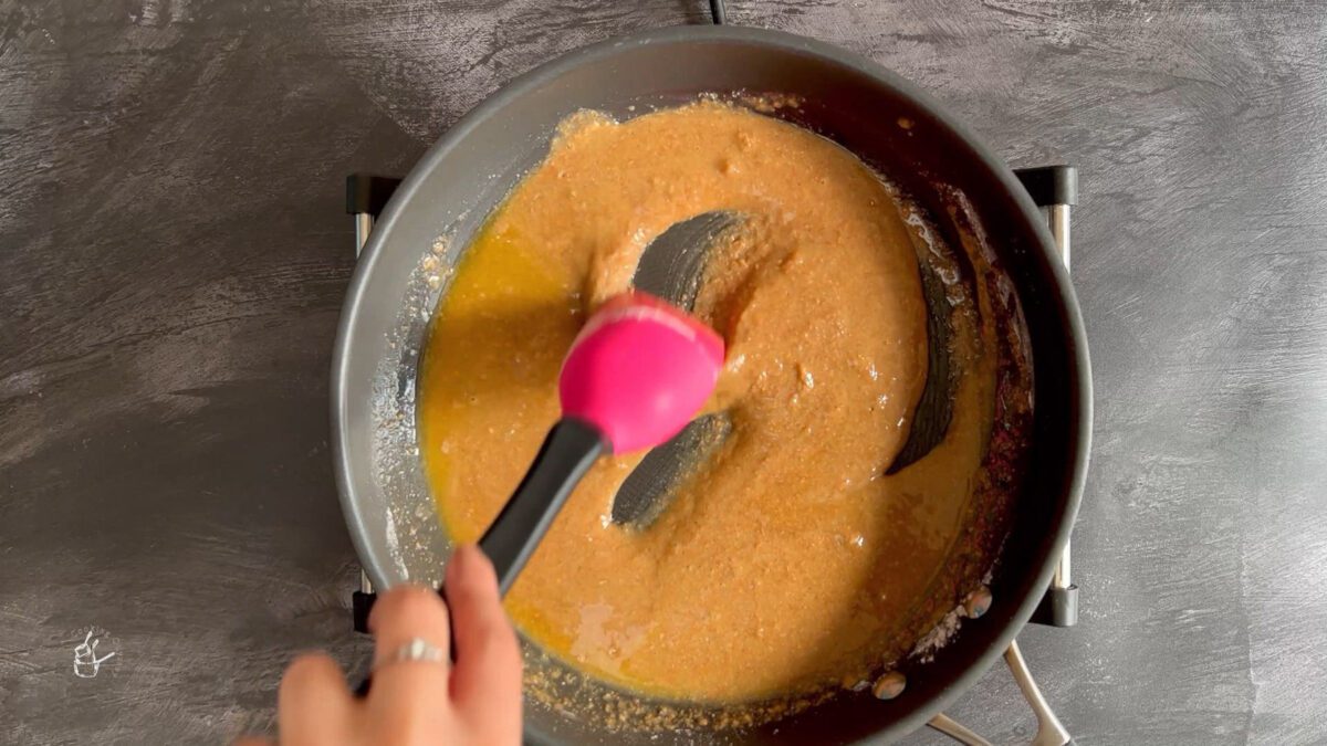 wheat flour and ghee mixture roasting in the frying pan