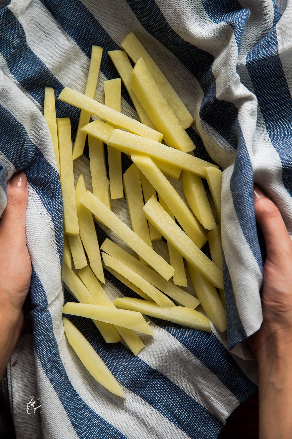 raw potato french fries on a kitchen napkin