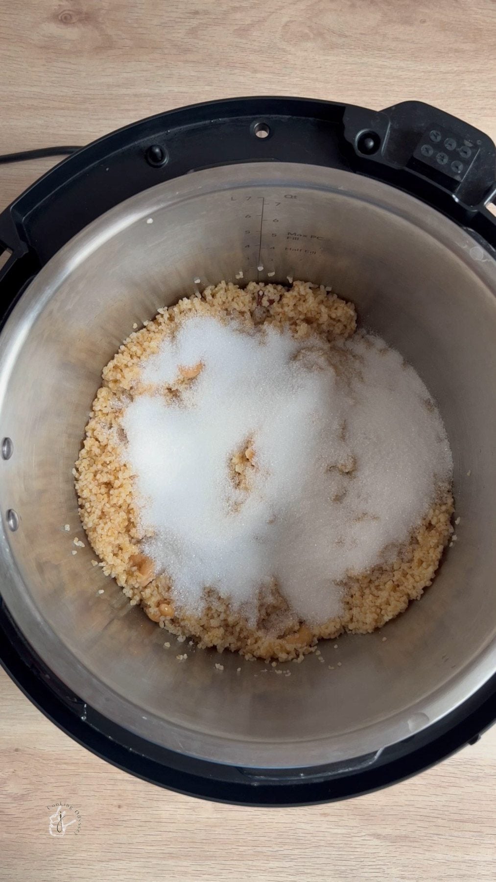 Sugar added to the cooked broken whta Dalia.