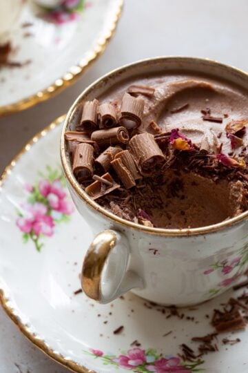 Airy chocolate mousse served in decorative tea cup.
