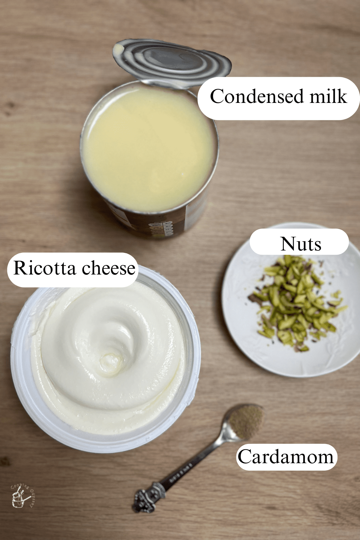 Open condensed milk tin and ricotta cheese container on the kitchen worktop.
