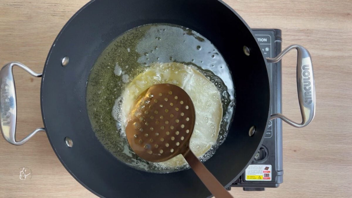 poppadom frying in hot oil