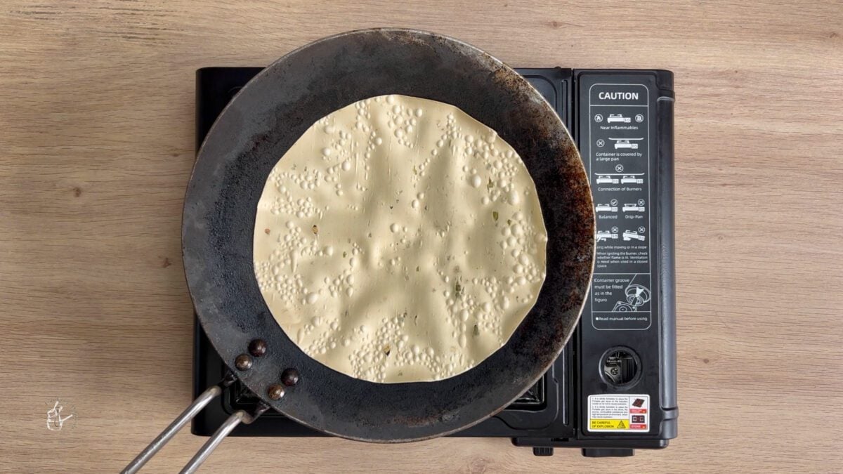 poppadum cooking on a griddle