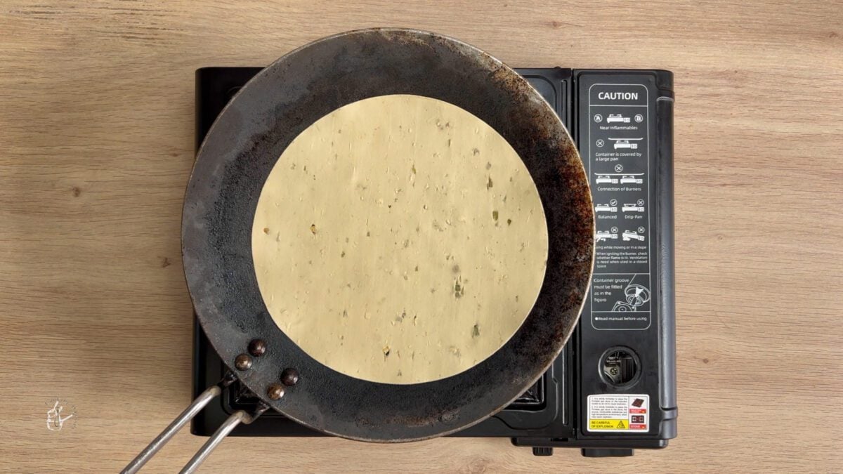 uncooked papad on hot griddle 