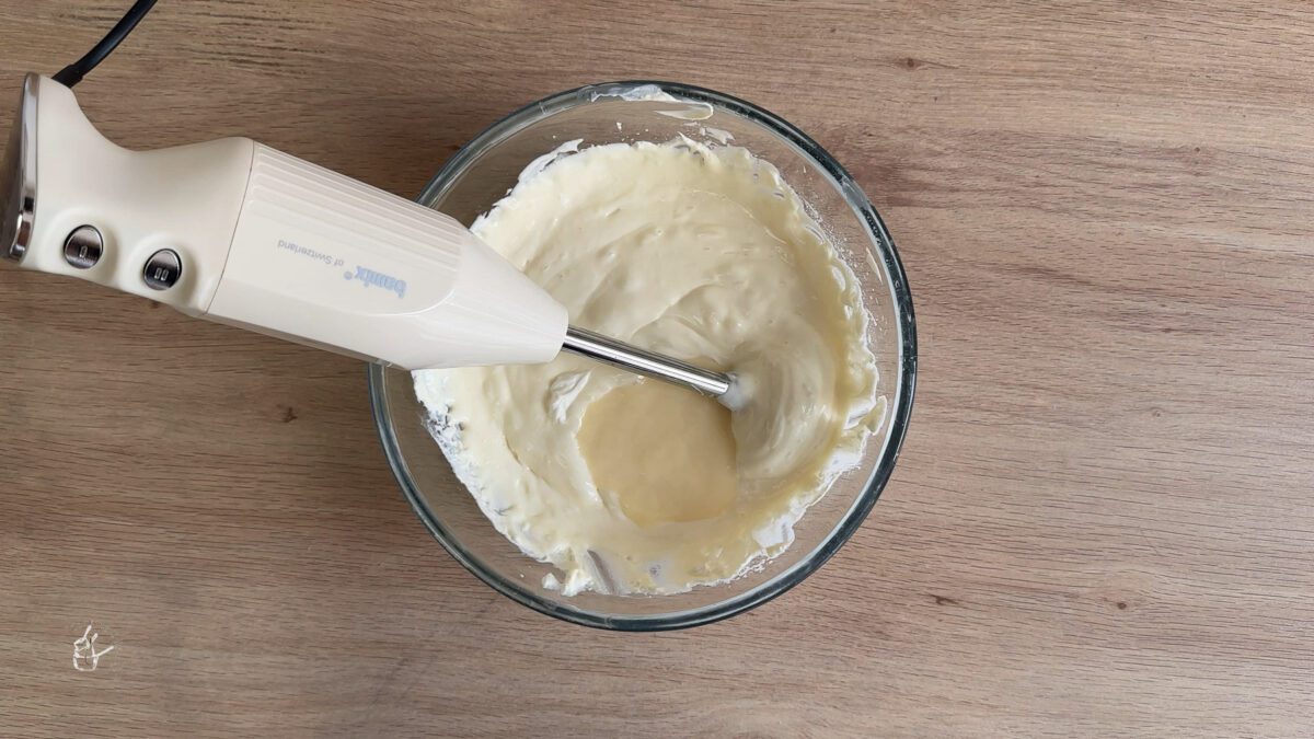 sweet condensed milk added to the cream cheese mixture in a bowl