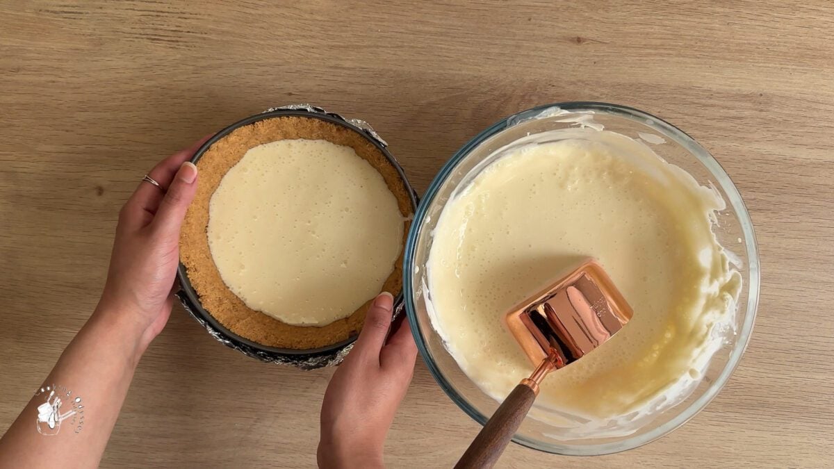 cheesecake filling poured into the cake tin