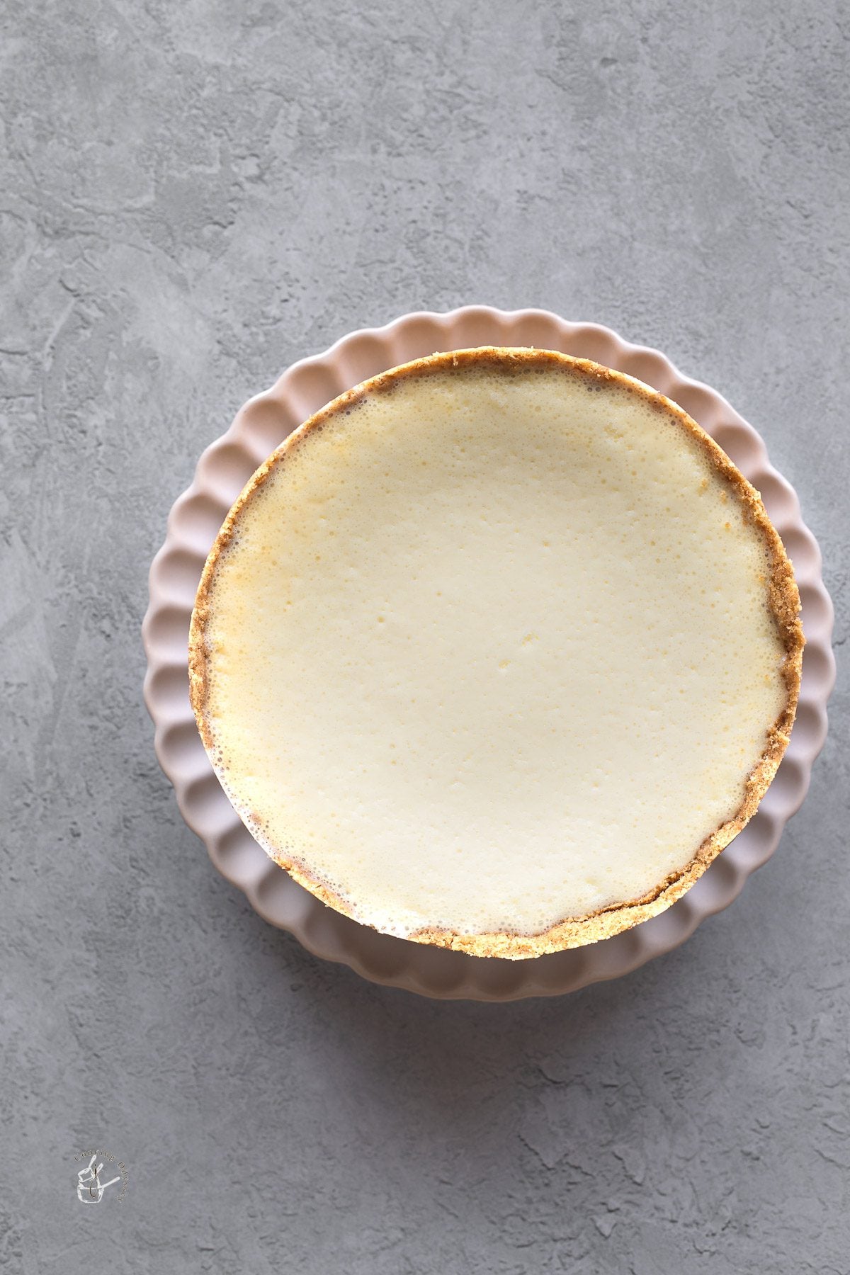 whole eggless cheesecake served on a white plate