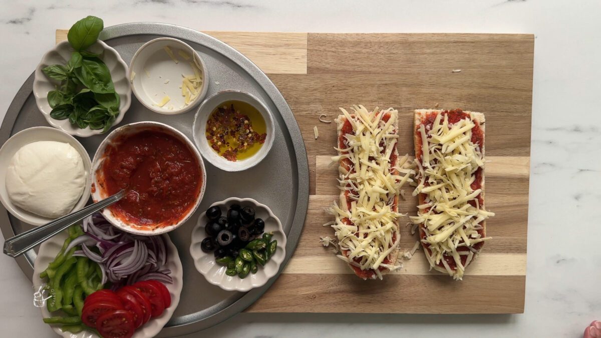 some grated cheese sprinkled on two bread slices