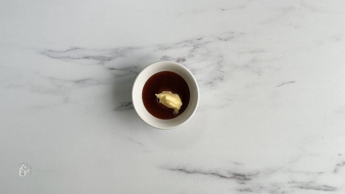 butter and butterscotch sauce in a small bowl
