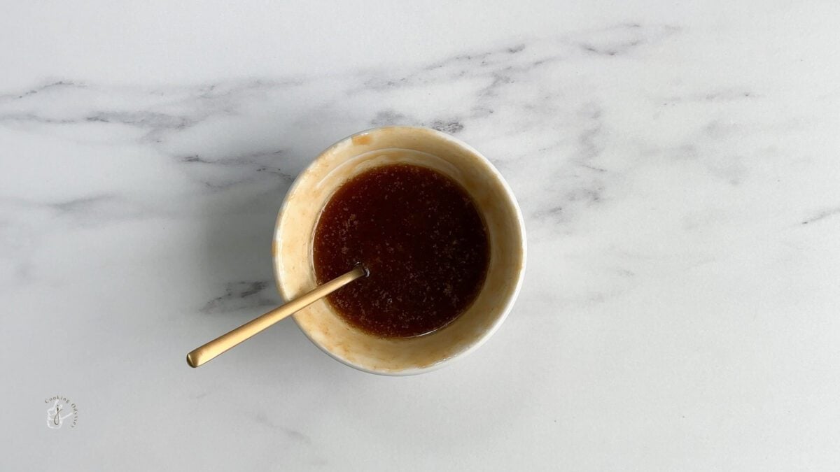 heated butter and caramel sauce in a small bowl