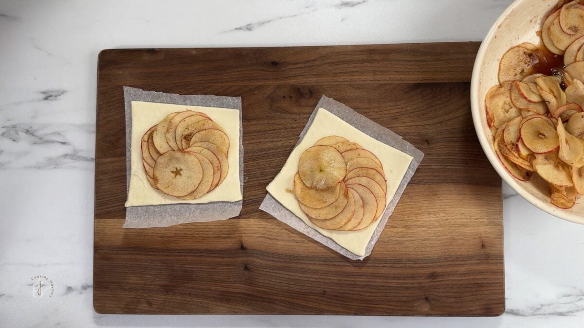 apple slices arranged on a puff pastry squares