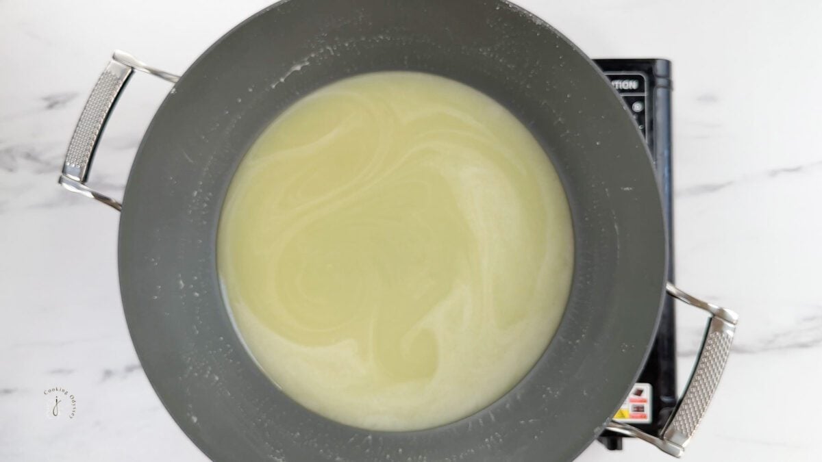 milk syrp for barfi in a pan