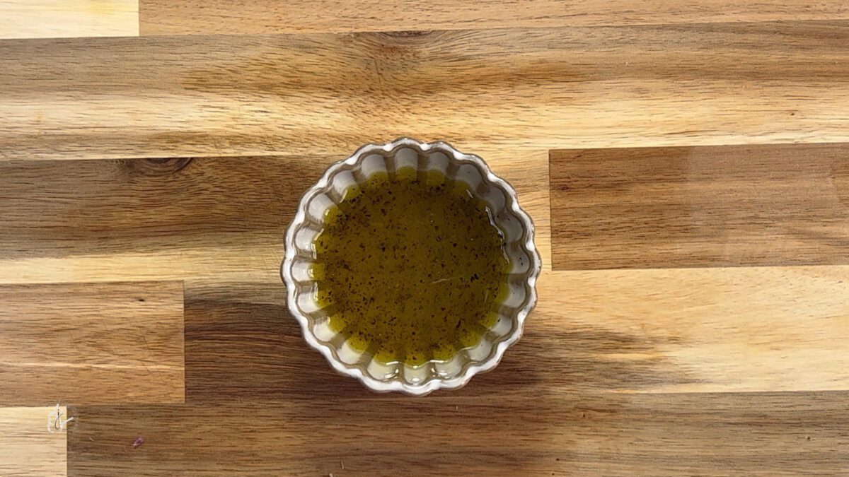 lemon and olive oil dressing in a small bowl