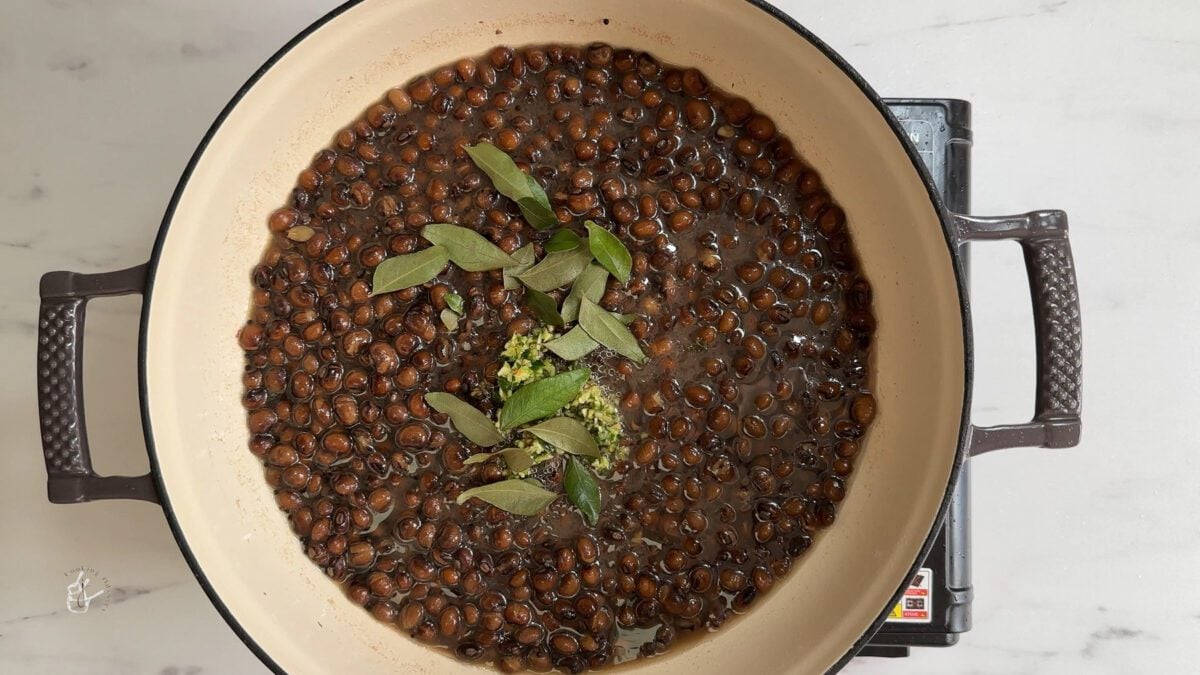 curry leaves and minced chilli ginger added to the boiled tuvar to make gujarati tuvar ki sabji