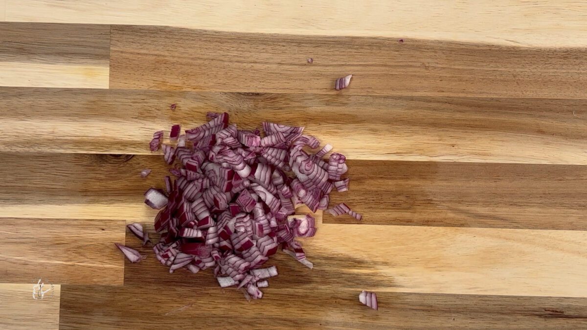 chopped red onion on the chopping board