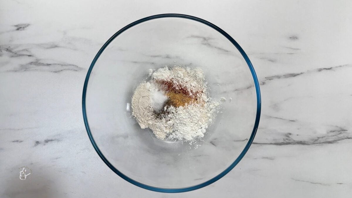 in a bowl mix of plain flour and spices to make batter for air fryer buffalo cauliflower no breading 