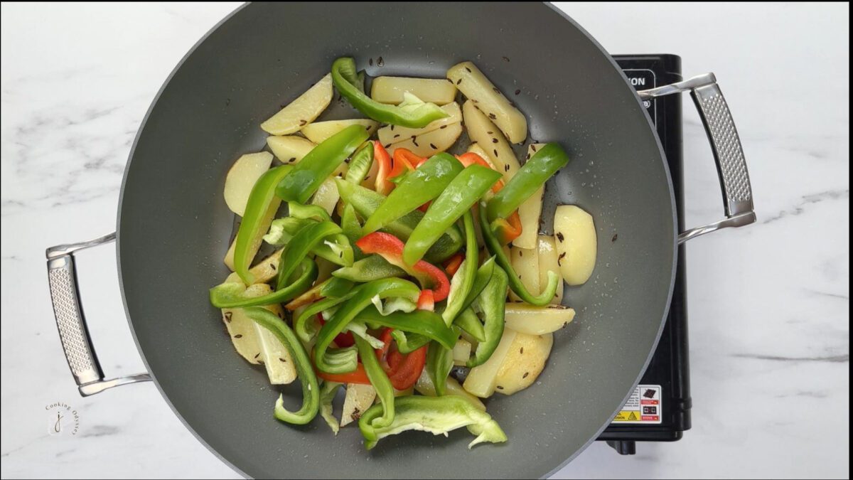 green bell peppers added to the potatoes