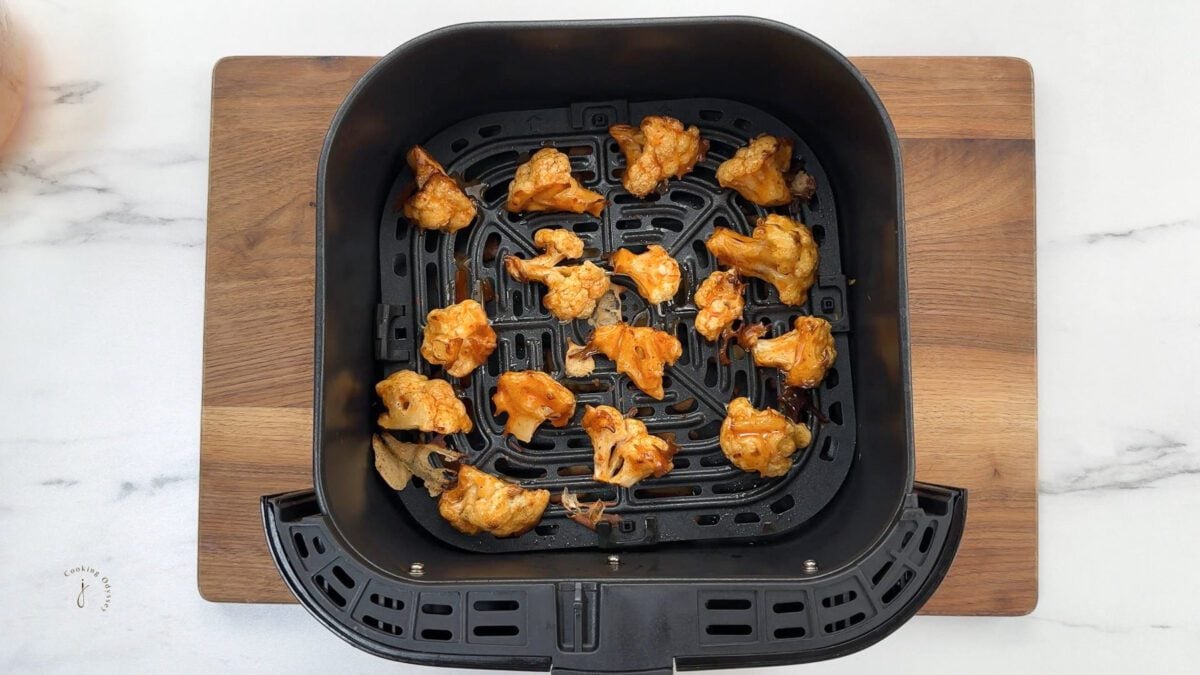 half cooked cauliflower florets dipped in the buffalo sauce 