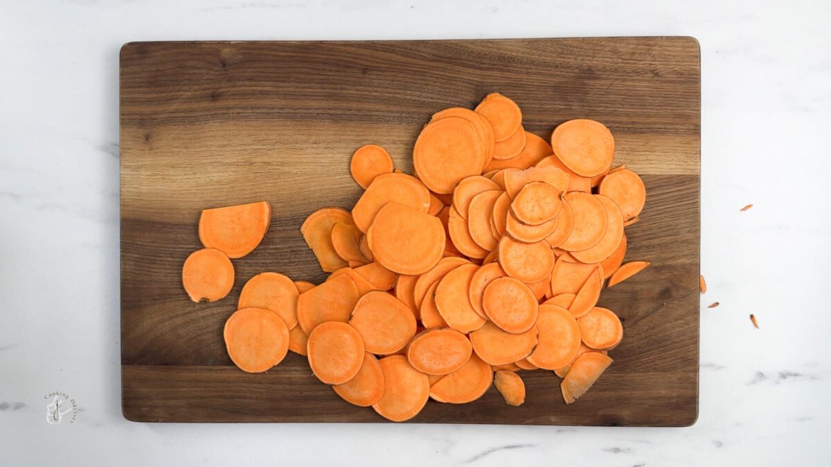 Thinly sliced sweet potato slices on the chopping board