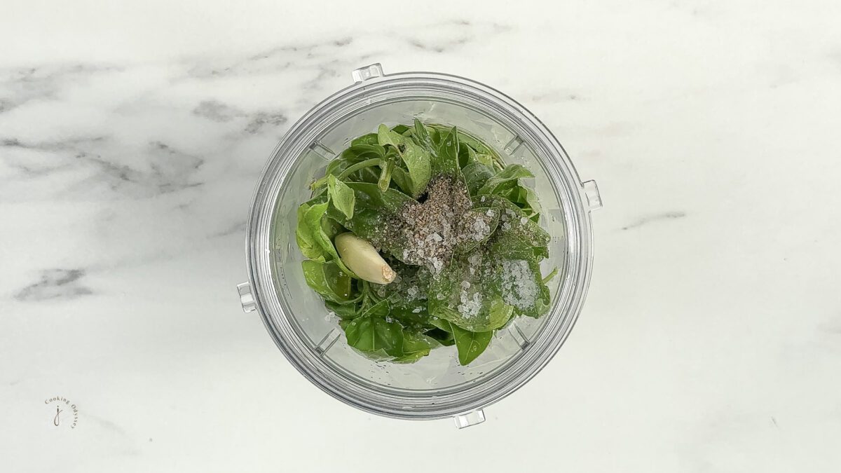 easy basil sauce ingredients in a blender jar