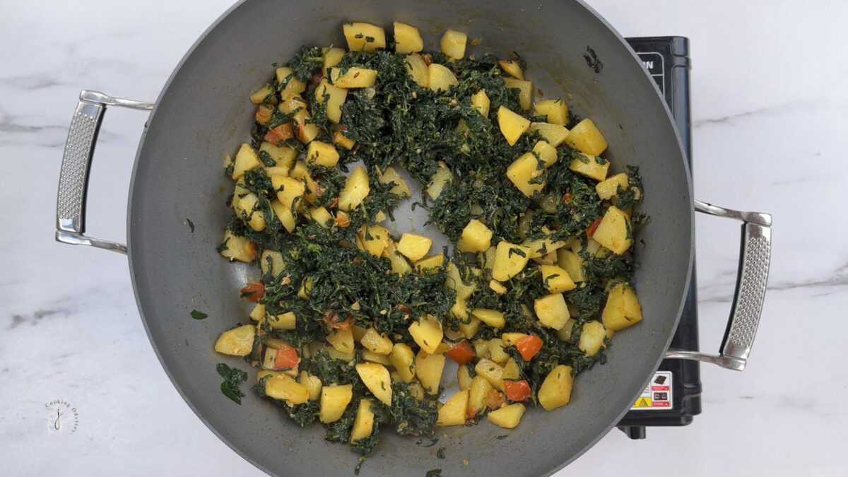 potato fenugreek leaves stir fry is ready in the pan 