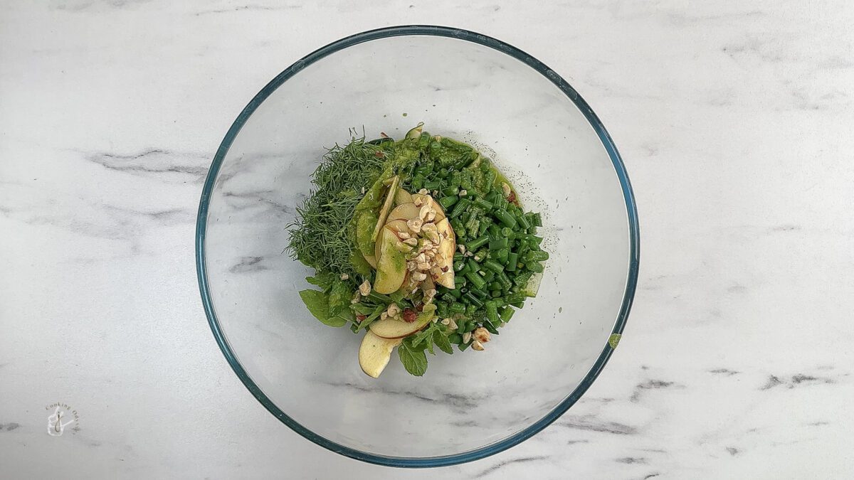 ingredients of zucchini salad in a bowl