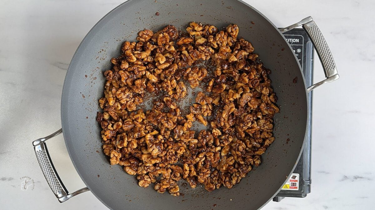 ingredients of candied walnuts for salad in a pan