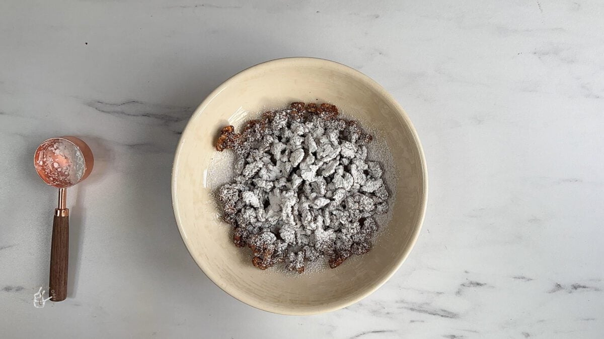 powdered sugar added to the roasted christmas walnuts 