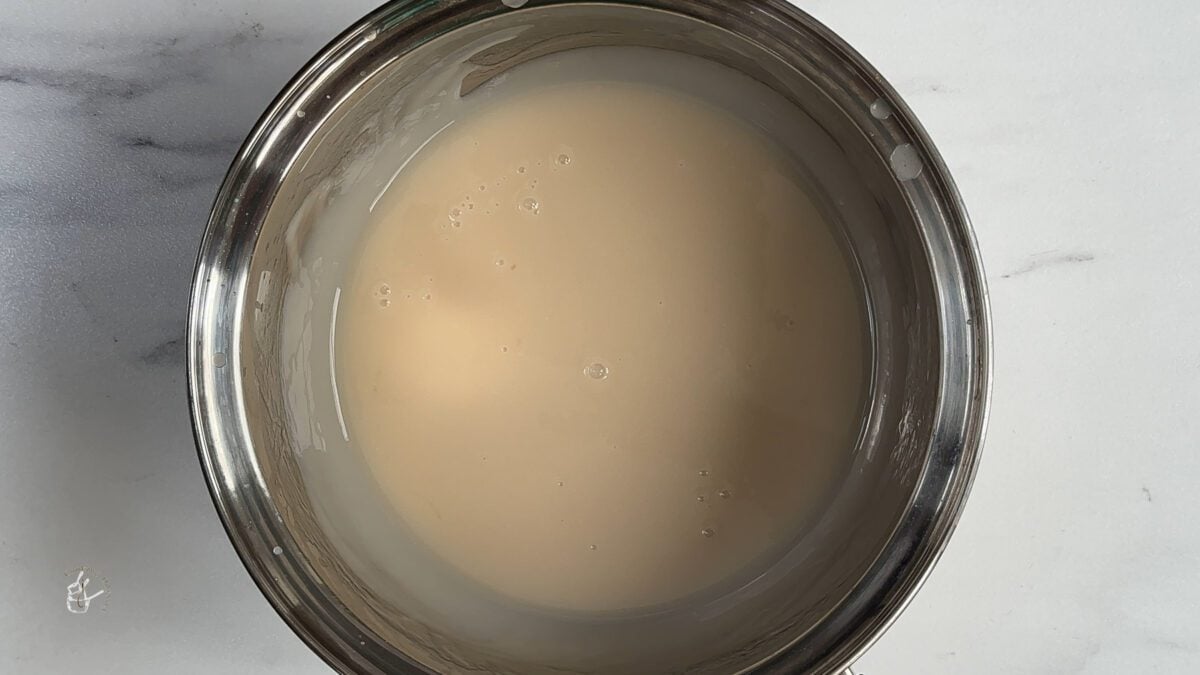 cooked coconut syrup cooling in the pan