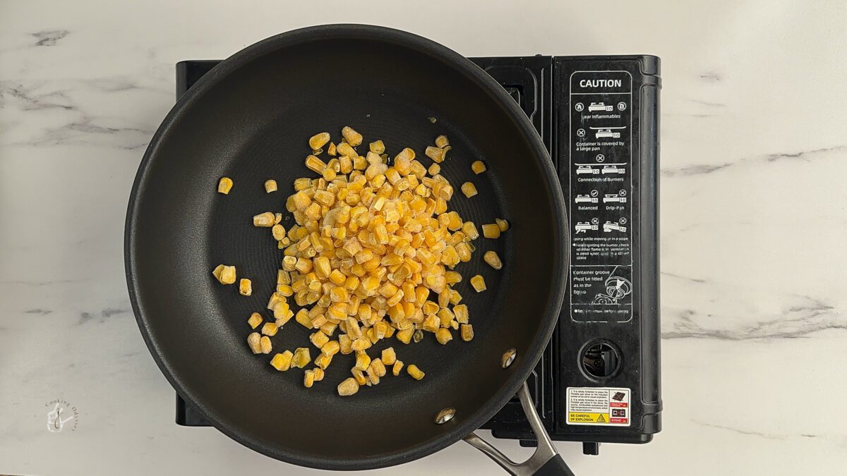 frozen sweetcorn are cooking to prepare corn chaat recipe