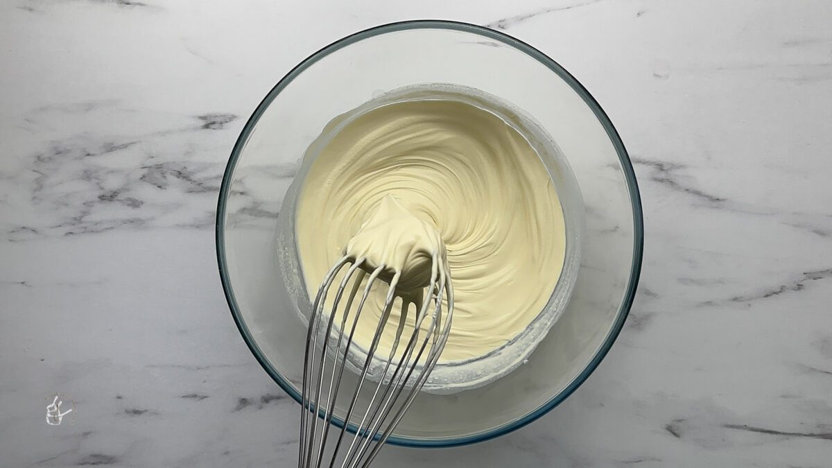 whipped double cream in the bowl for rasmalai cake eggless