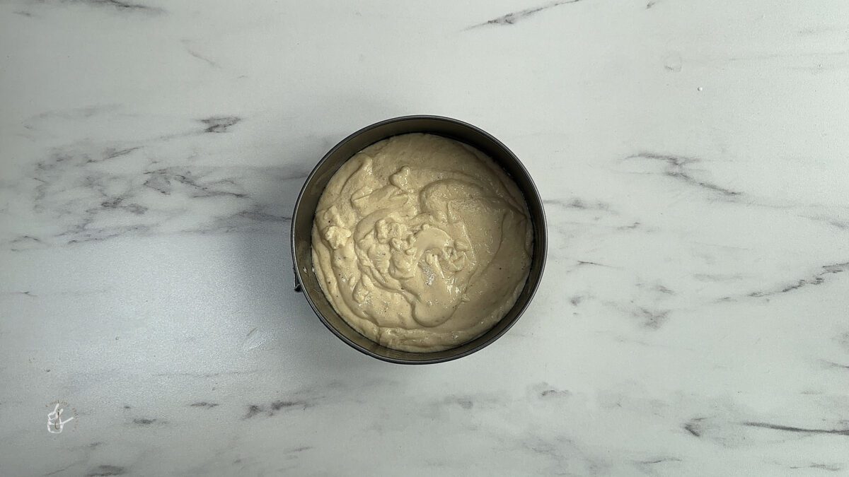 cake batter in the lined cake tin