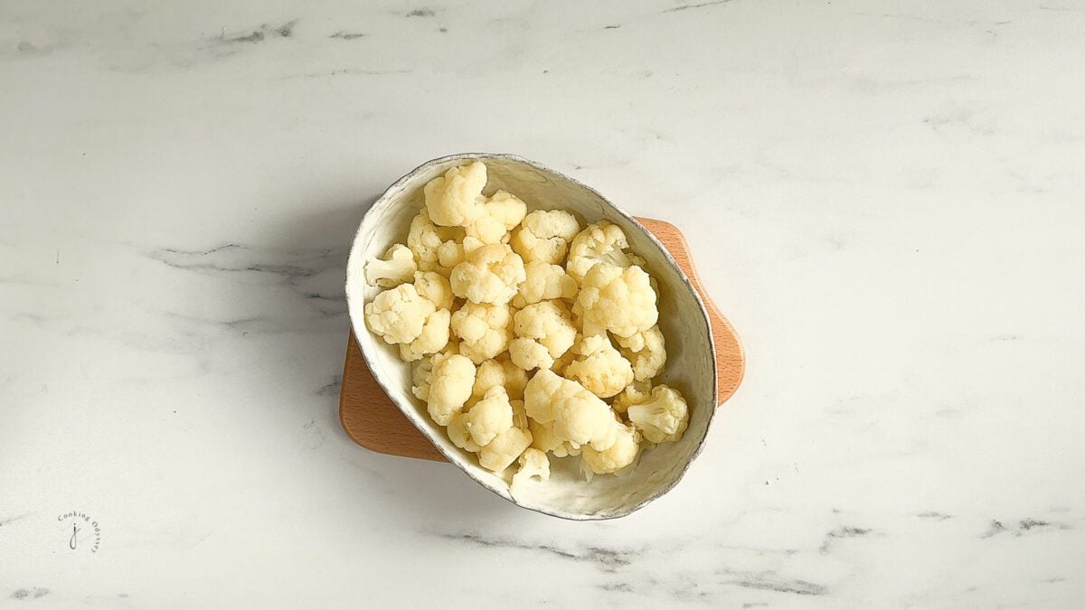 blanched and cooled cauliflower florets in the baking dish